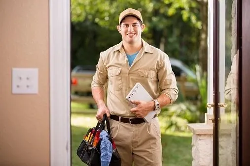 Essential Mobility technician arriving at a San Luis Obispo home with tools and parts for a power wheelchair repair