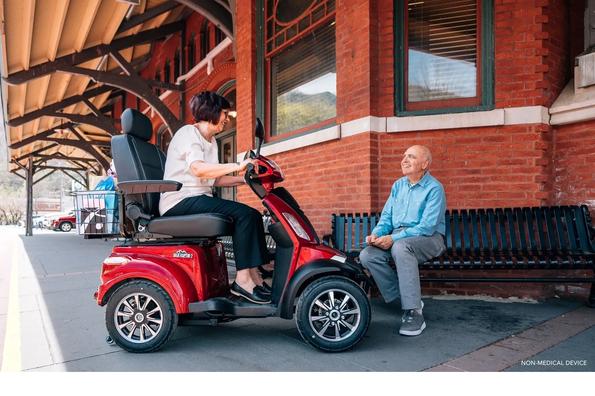 Senior on a heavy-duty mobility scooter at a Central Coast train station