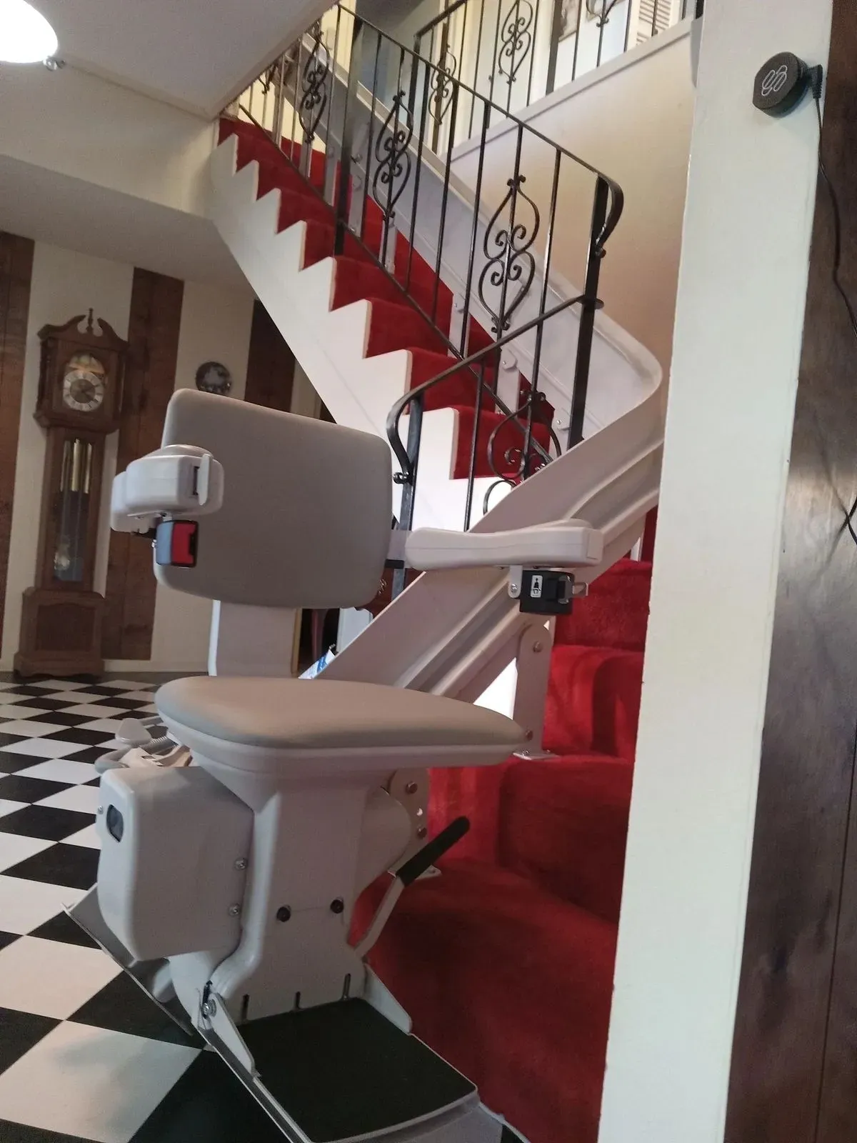 Custom curved stair lift installed on stairs with a landing in Paso Robles, California